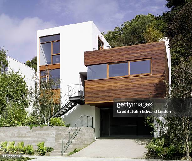 modern stucco and wood clad house - modern garage stock pictures, royalty-free photos & images