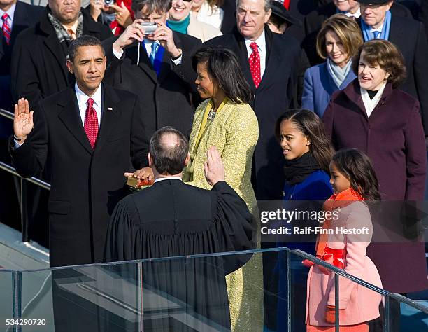 President-Elect Barack Obama is sworn in by Chief Justice John Roberts as the 44th President of the United States, during his Inauguration in...