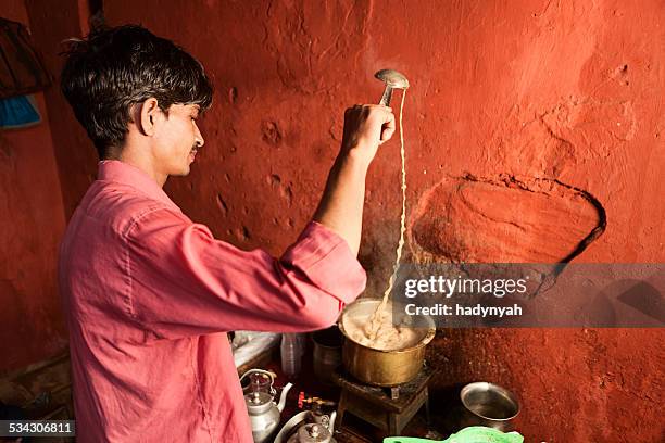 indian street seller selling tea - masala chai - chai tea stock pictures, royalty-free photos & images