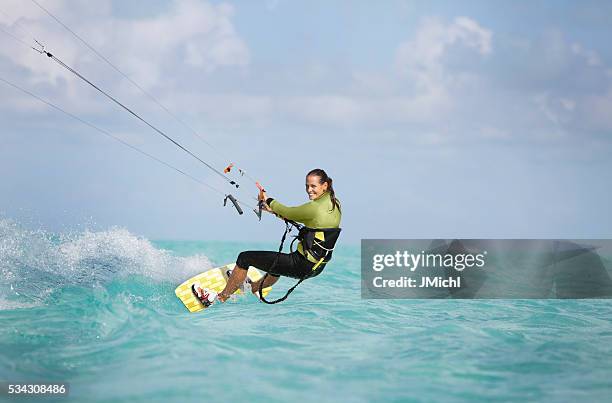 kite boarding woman in the caribbean. - kiteboard stockfoto's en -beelden