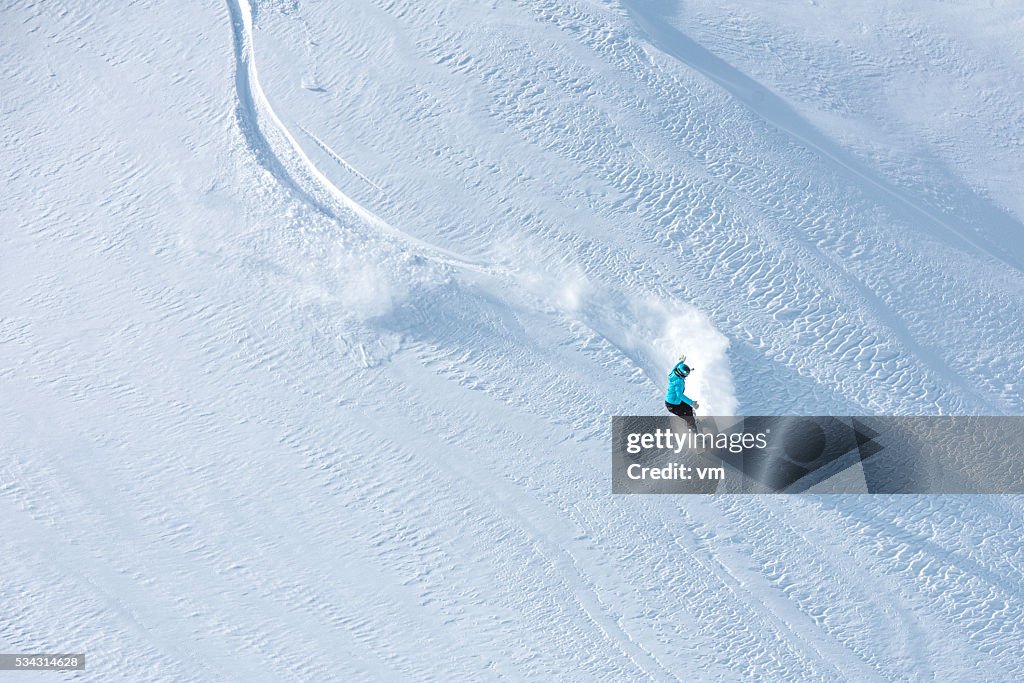 Skier skiing off-piste on a beatiful mountain slope