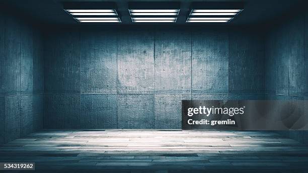 dark, spooky, empty office or basement room - prison cell stockfoto's en -beelden