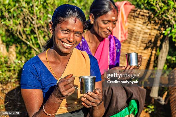 tamil women drinking fresh tea on plantation, ceylon - sri lanka tea plantation stock pictures, royalty-free photos & images