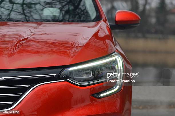led headlight in a new vehicle - renault nissan stock pictures, royalty-free photos & images
