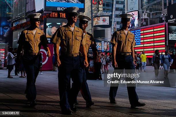 Marines walk around Times Square during Fleet Week on May 25, 2016 in New York City. Nearly 4,500 Sailors, Marines and Coast Guardsmen will...