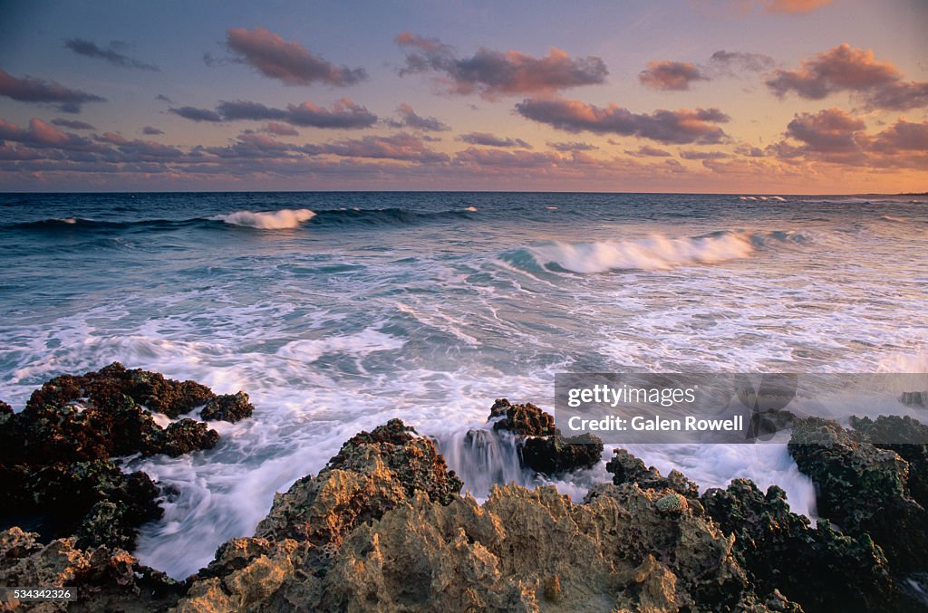 Waves Breaking On Rocks At Sunrise High-Res Stock Photo - Getty Images