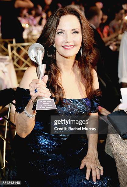 Honoree Lynda Carter poses with her Lifetime Achievement Award at the 41st Annual Gracie Awards at Regent Beverly Wilshire Hotel on May 24, 2016 in...