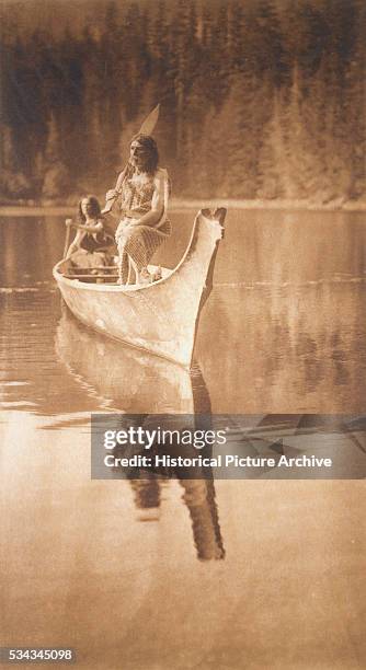 This canoe is floating on the waters of Boston cove, where in 1803 the trading ship Boston was taken and burned by the Mooachaht Indians, and the...