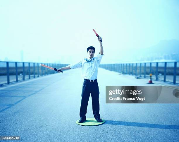 man directing air traffic - airport ground crew stock pictures, royalty-free photos & images