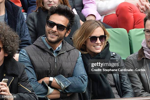 Maxime Nucci and Isabelle Ithurburu at Roland Garros on May 24, 2016 in Paris, France.