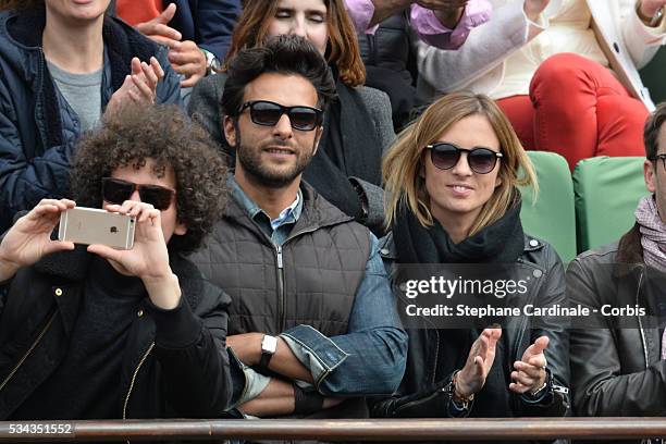 Maxime Nucci and Isabelle Ithurburu at Roland Garros on May 24, 2016 in Paris, France.