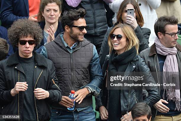 Maxime Nucci and Isabelle Ithurburu at Roland Garros on May 24, 2016 in Paris, France.