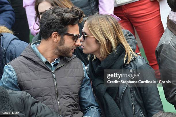 Maxime Nucci and Isabelle Ithurburu at Roland Garros on May 24, 2016 in Paris, France.