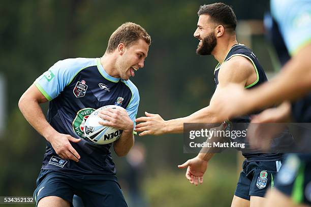 Matt Moylan of the Blues runs the ball at Josh Mansour of the Blues during a New South Wales State of Origin media opportunity on May 26, 2016 in...