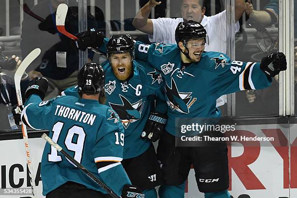 Joe Pavelski of the San Jose Sharks celebrates his goal against the St. Louis Blues with Joe Thornton and Tomas Hertl in Game Six of the Western...