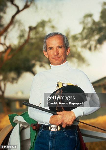 Jockey Willie Shoemaker with Riding Crop and Hat