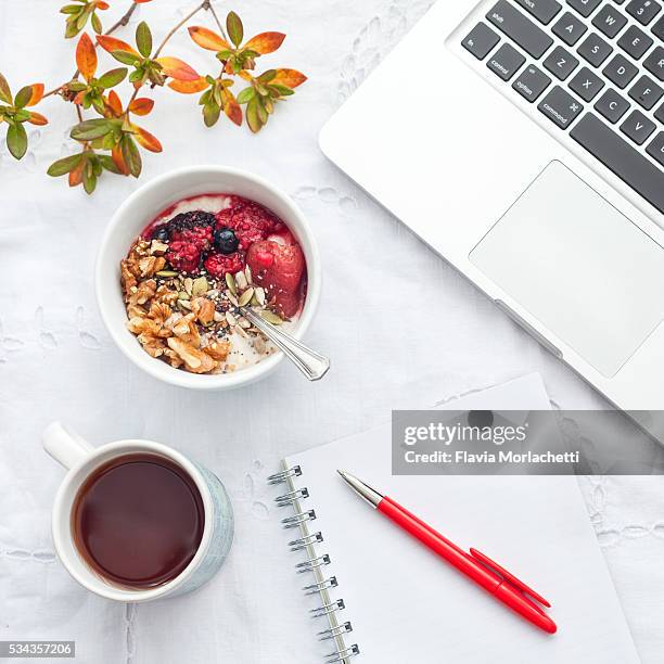 breakfast and work - breakfast work stock pictures, royalty-free photos & images