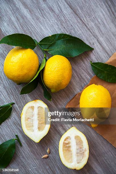 lemons with leaves still life - alkaline food stock pictures, royalty-free photos & images