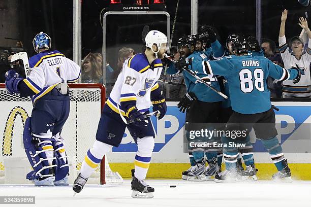 Joel Ward of the San Jose Sharks celebrates his goal with teammates in Game Six of the Western Conference Final against the St. Louis Blues during...