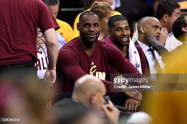 LeBron James and Tristan Thompson the Cleveland Cavaliers look on from the bench in the fourth quarter against the Toronto Raptors in game five of...