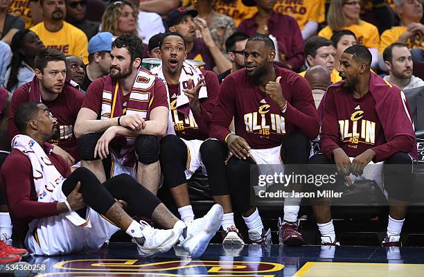 Smith, Matthew Dellavedova, Kevin Love, Channing Frye, LeBron James and Tristan Thompson of the Cleveland Cavaliers look on from the bench late in...