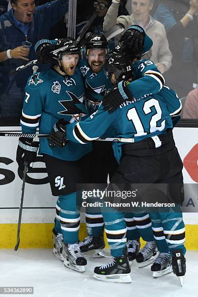 Joonas Donskoi of the San Jose Sharks celebrates his goal with teammates Paul Martin, Patrick Marleau and Logan Couture in Game Six of the Western...