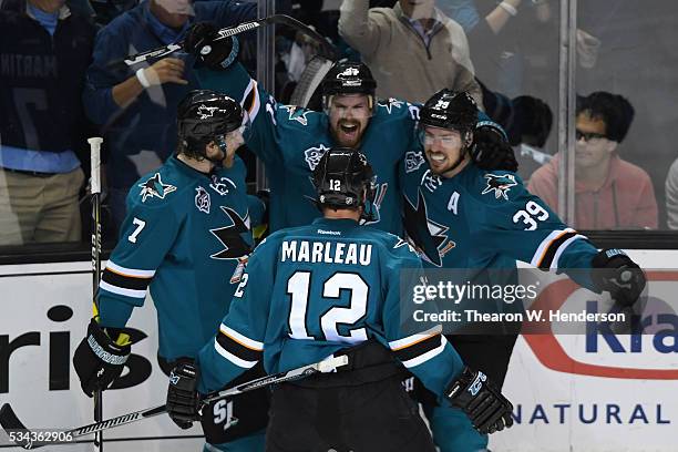 Joonas Donskoi of the San Jose Sharks celebrates his goal with teammates Paul Martin, Patrick Marleau and Logan Couture in Game Six of the Western...