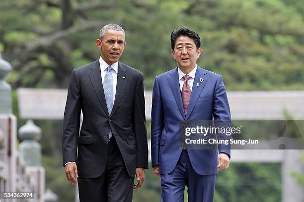 President Barack Obama walks with Japanese Prime Minister Shinzo Abe on the Ujibashi bridge as they visit at the Ise-Jingu Shrine on May 26, 2016 in...