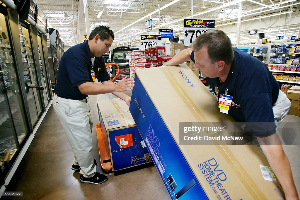 Walmart Rep Wal-Mart employees Robert Jimenez and Tom Ondrey stock merchandise at ...