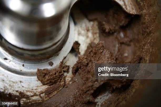 Cocoa mass, made from Ogasawara cocoa beans, is seen in a cocoa grinder at a Hiratsuka Confectionery Co. Factory in Soka City, Saitama Prefecture,...