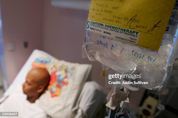 Eighteen-year-old cancer patient Patrick McGill lies in his hospital bed while receiving IV chemotherapy treatment for a rare form of cancer at the...