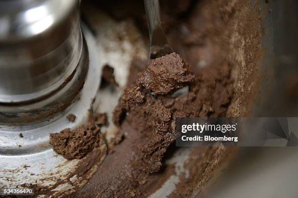 Cocoa mass, made from Ogasawara cocoa beans, is seen in a cocoa grinder at a Hiratsuka Confectionery Co. Factory in Soka City, Saitama Prefecture,...