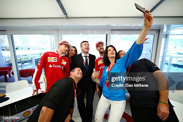 Tanja Bauer, Sky F1 Germany, takes a selfie with Kimi Raikkonen of Finland and Ferrari, Sebastian Vettel of Germany and Ferrari, Federica Masolin and...
