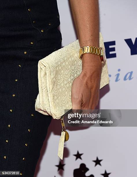 Model Cindy Crawford, clutch and watch detail, arrives at the 7th Annual Big Fighters, Big Cause Charity Boxing Night Benefiting The Sugar Ray...