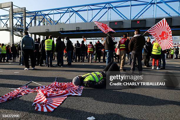 Unionists block the tollgate of the "Pont de Normandie", in Le Havre northwestern France, on May 26 to protest against the government's proposed...