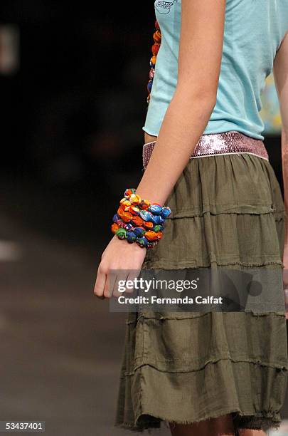 Model walks down the runway during the Mercearia fashion presentation during the Pre-a-Porter fashion exhibition at Joquei Club on August 11, 2005 in...