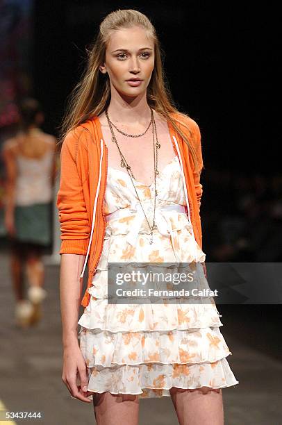 Model walks down the runway during the Mercearia fashion presentation during the Pre-a-Porter fashion exhibition at Joquei Club on August 11, 2005 in...