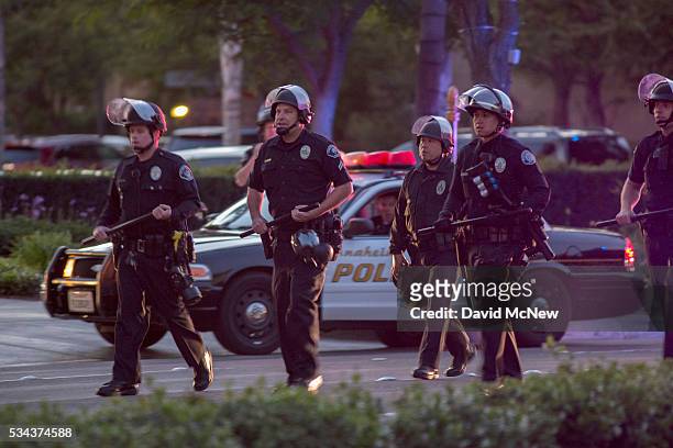 Police advance to make possible mass arrests after declaring an unlawful assembly following a campaign rally by presumptive GOP presidential...