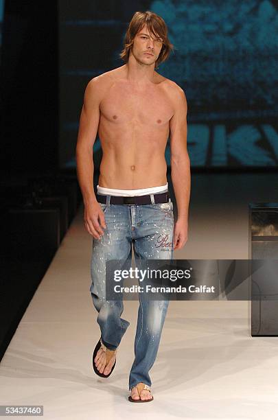 Model walks down the runway during the Sergio K. Fashion presentation during the Pre-a-Porter fashion exhibition at Joquei Club on August 11, 2005 in...