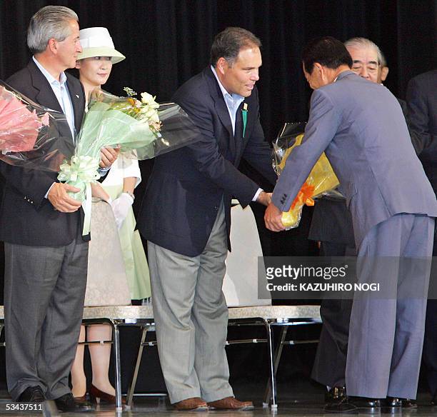 Panamanian Vice President Samuel Navarro receives a bouquet by Satoshi Igeta, during a ceremony of the Central America National Day for the 2005...