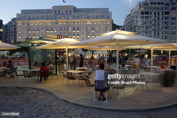 Stylized and standardized Kiosk named Itaipava with restaurant and bar at Copacabana beach sidewalk, in front of Copacabana Palace hotel, Rio de...