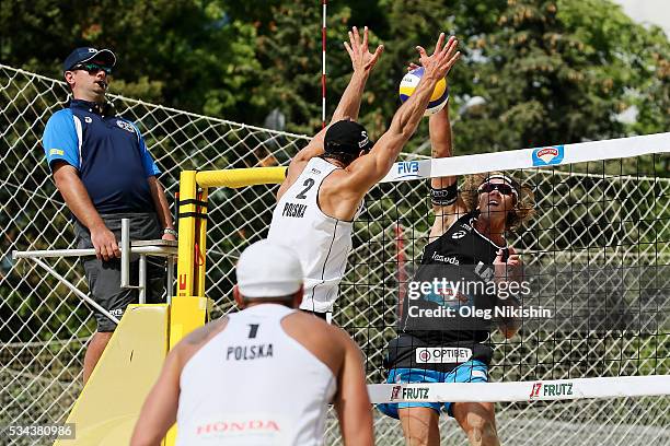 Michal Kadziola of Poland blocks an attack of Aleksandrs Samoilovs of Latvia during 2nd day of the FIVB Moscow Grand Slam on May 25, 2016 in Moscow,...