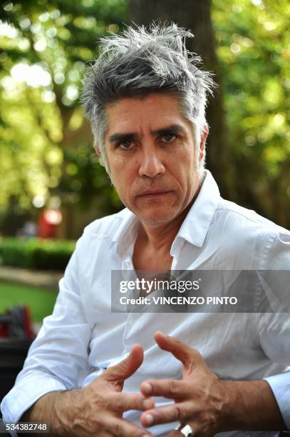 Chilean architect, Alejandro Aravena, speaks during an interview at the opening of the 15th International Architecture Exhibition in Venice on May...