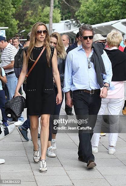 Hugh Grant and Anna Elisabet Eberstein attend Andy Murray's match on day 4 of the 2016 French Open held at Roland-Garros stadium on May 25, 2016 in...