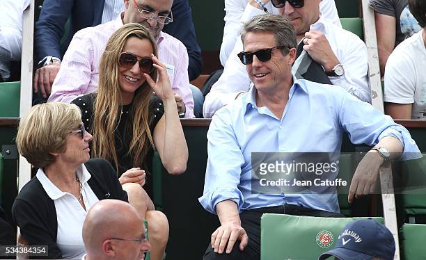 Hugh Grant and Anna Elisabet Eberstein attend Andy Murray's match on day 4 of the 2016 French Open held at Roland-Garros stadium on May 25, 2016 in...