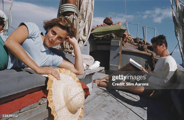 Princess Laudomia Hercolani and Prince Andrea Hercolani relaxing an on-deck whilst cruising around the Aeolian Islands, 1954.
