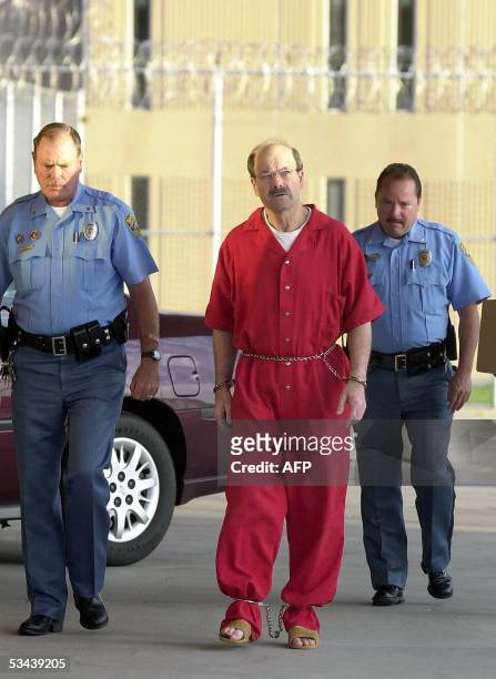 El Dorado, UNITED STATES: Dennis L. Rader , the man admitting to be the BTK serial killer, is escorted into the El Dorado Correctional Facility on 19...