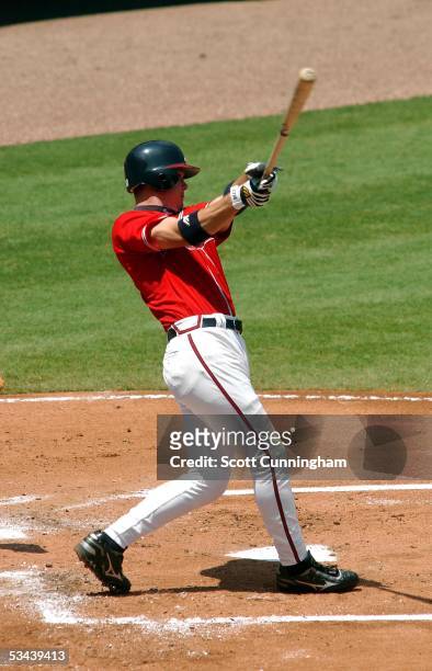 Chipper Jones of the Atlanta Braves follows through on a home run against the Arizona Diamondbacks at Turner Field on August 14, 2005 in Atlanta,...