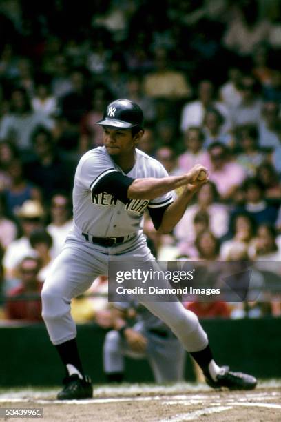 Matty Alou of the New York Yankees strides into a pitch during a game in August 1973 against the Detroit Tigers at Tiger Stadium in Detroit, Michigan.