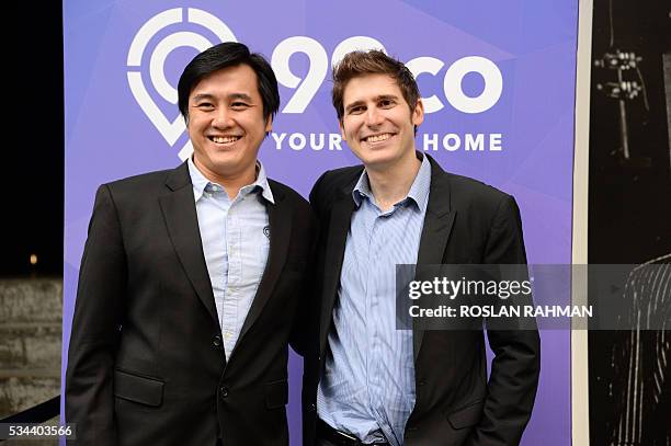 Facebook co-founder Eduardo Saverin and Darius Cheung co-founder of BillPin and CEO co-founder of McAfee-acquired tenCube pose for photographs at the...